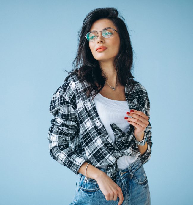 Young beautiful woman in casual outfit isolated in studio Young beautiful woman in casual outfit isolated in studio